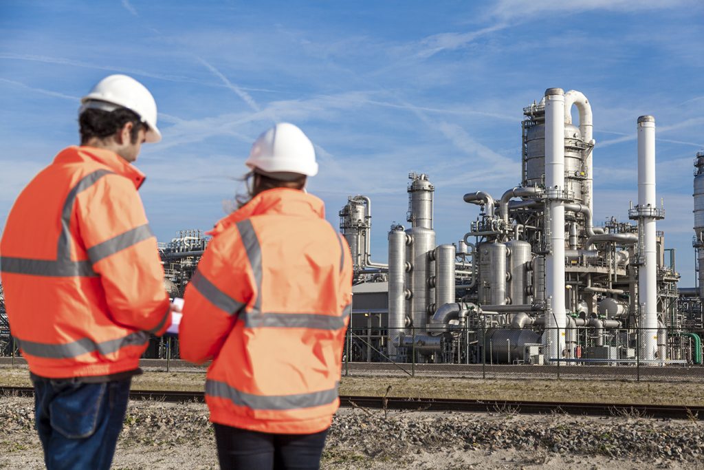 Industrial workers with chemical plant